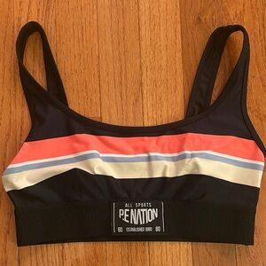 P.E Nation Black Sports Bra with orange, blue and Cream Stripes